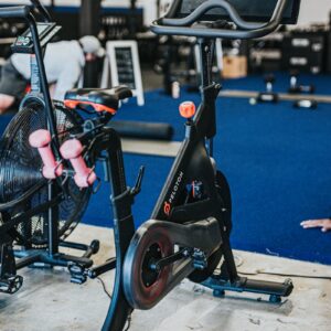 black and blue trike on gray concrete floor